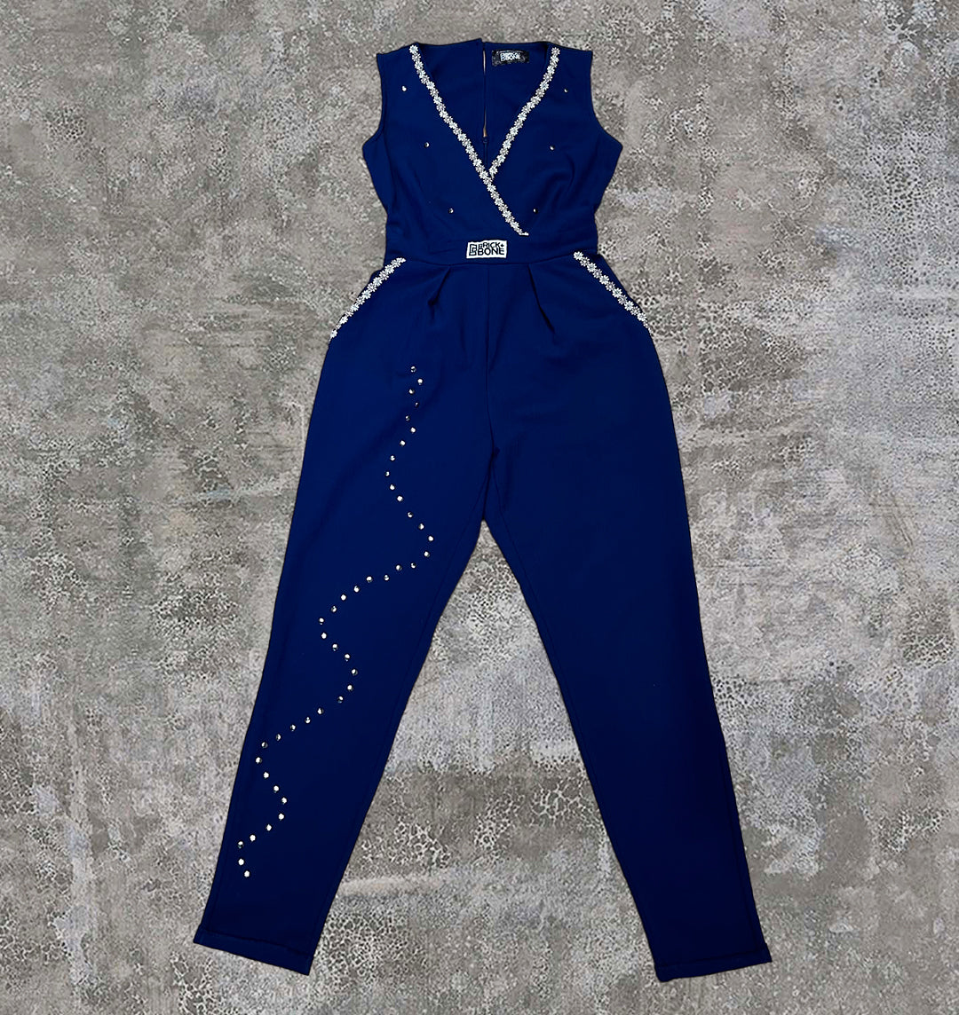 Violet, blue upcycled jumpsuit with lace trim and hand studded detailing cascading down the leg