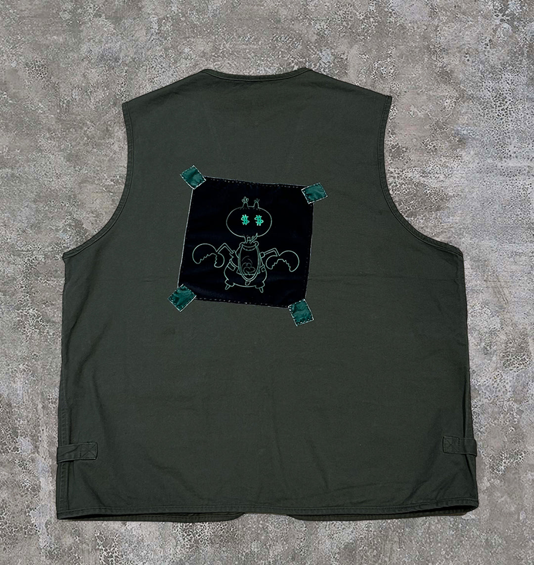 Back of utility vest with soft velvet patchwork with a hand illustrated Mr Krabs graphic