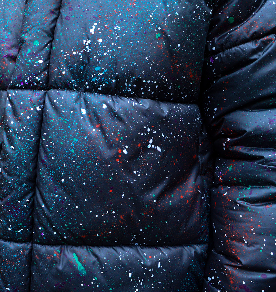 Close up left side of paint splattered puffer jacket 