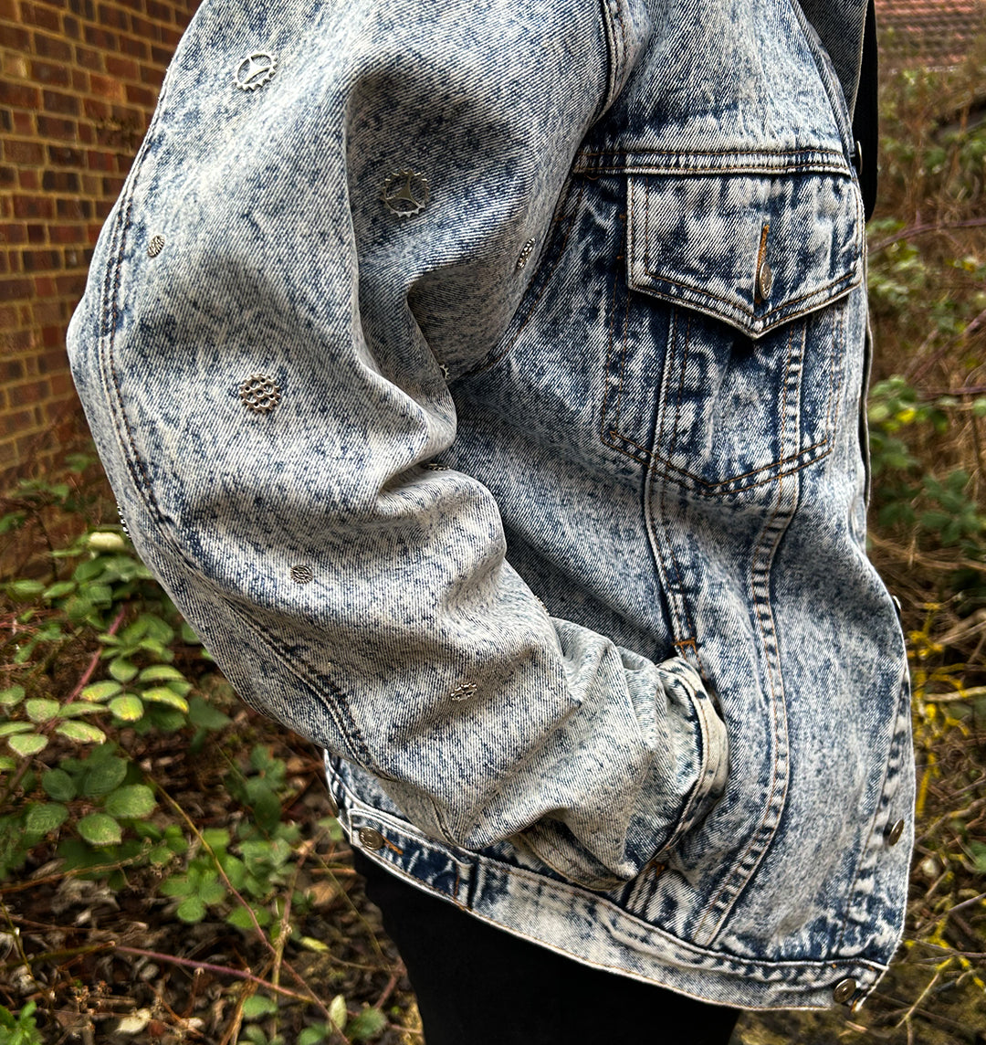 Hand embellished sleeves on the acid washed denim jacket