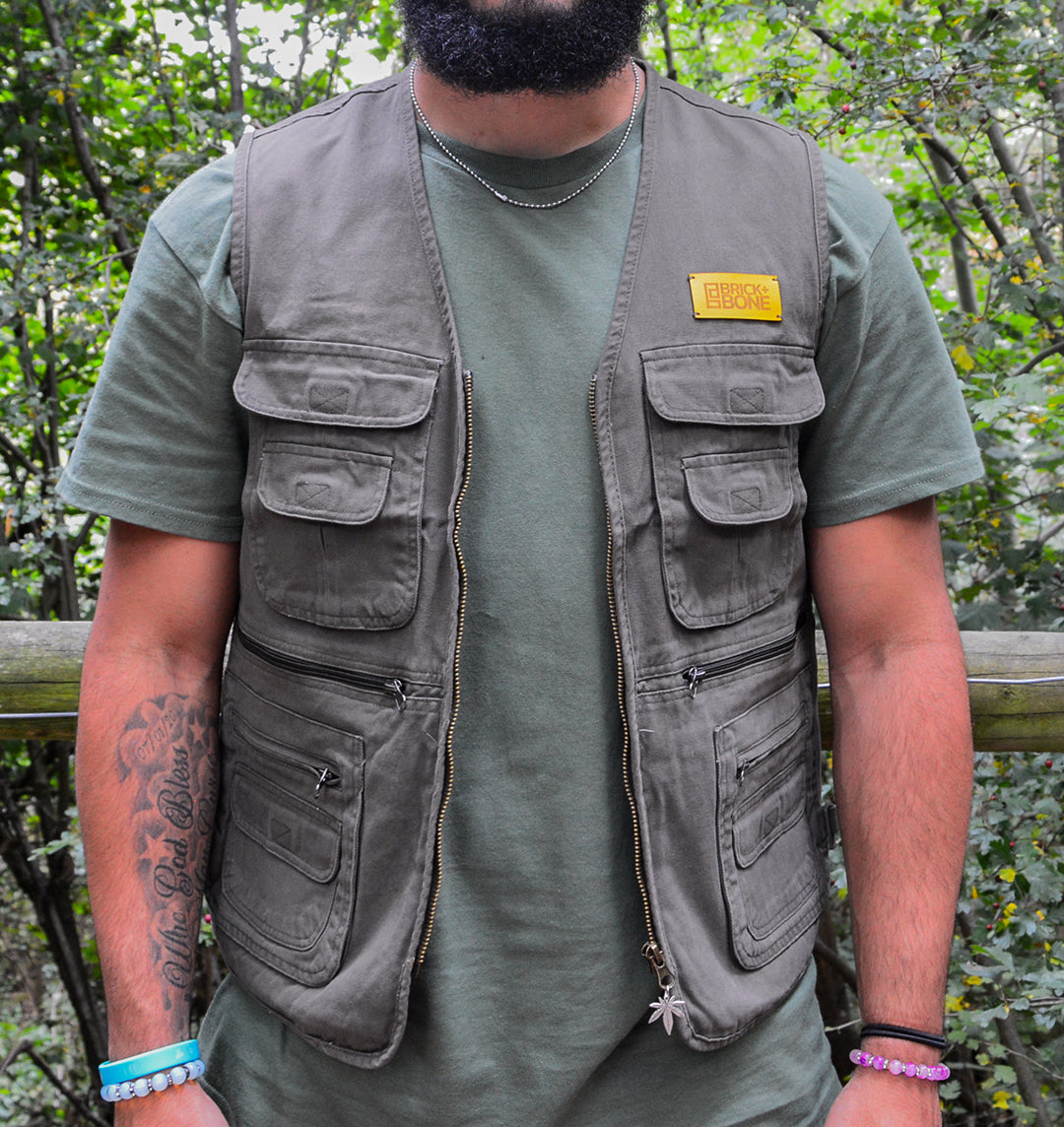 Khaki utility vest, BRICK + BONE leather logo in mustard on the breast